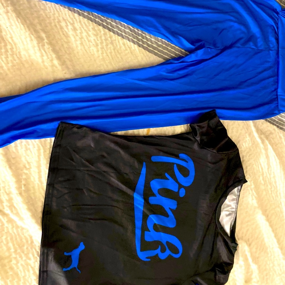 A blue and black puma designer outfit
